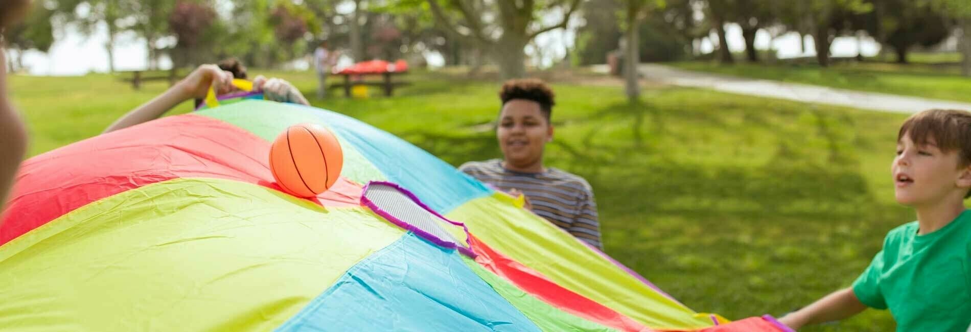 Kids Playing with Colored Tarp
