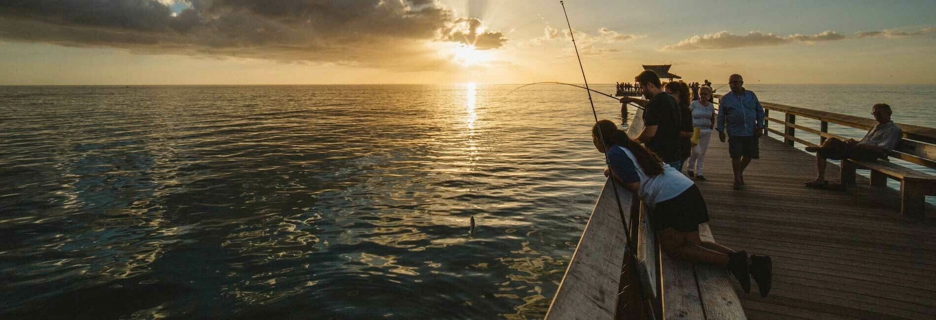 People Fishing From Pier