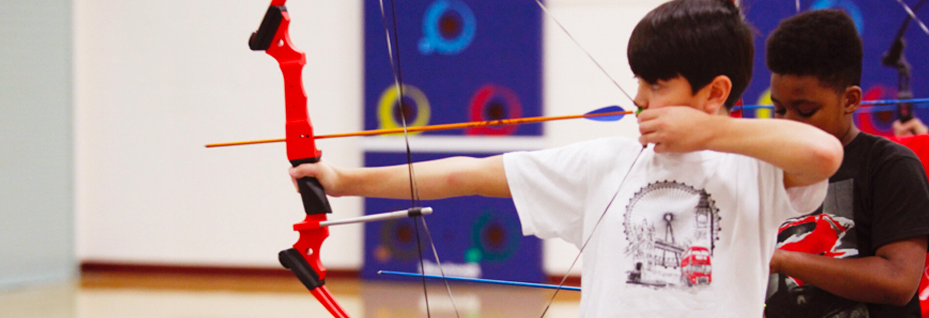 Child Shooting Bow and Arrow