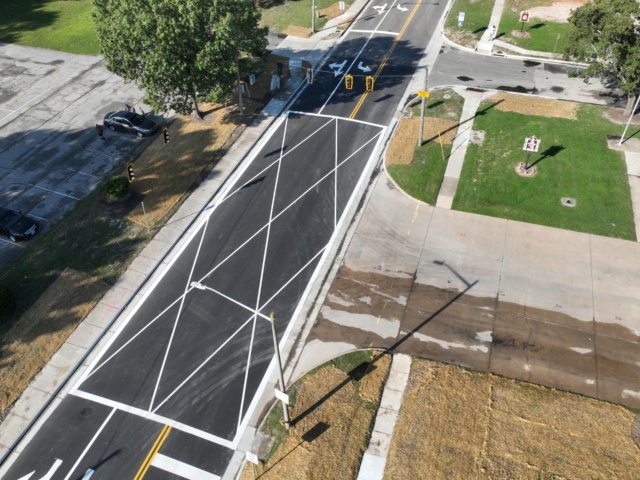 Aerial view of the completed drainage improvements project looking west along South Plaza Trail