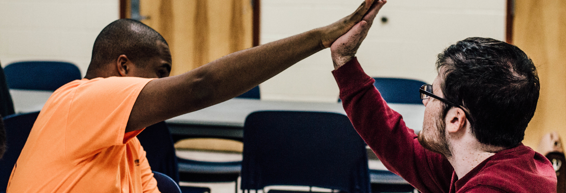 Parks and Rec staff member high fiving participant