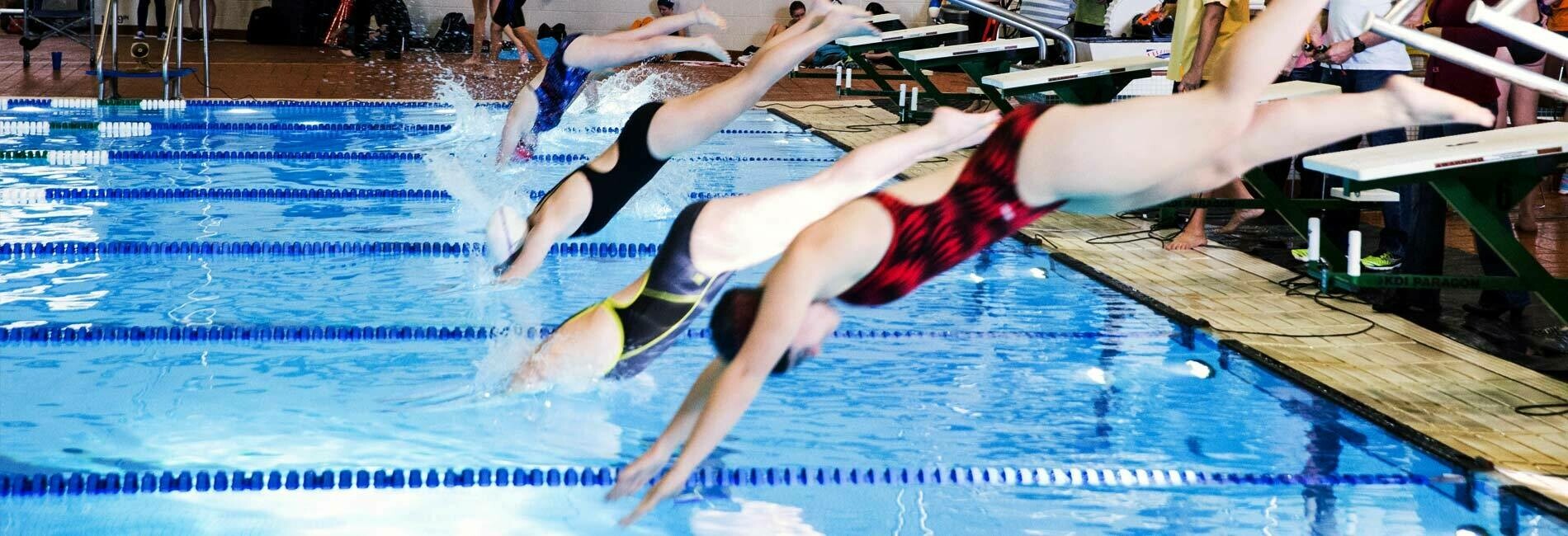 Children Swimming in a Swim League Competition