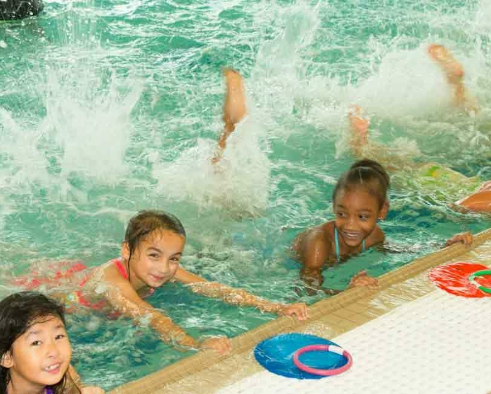 Students on Wall of Swimming Pool